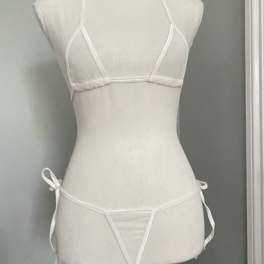 Never worn, white super sheer teeny bikini.